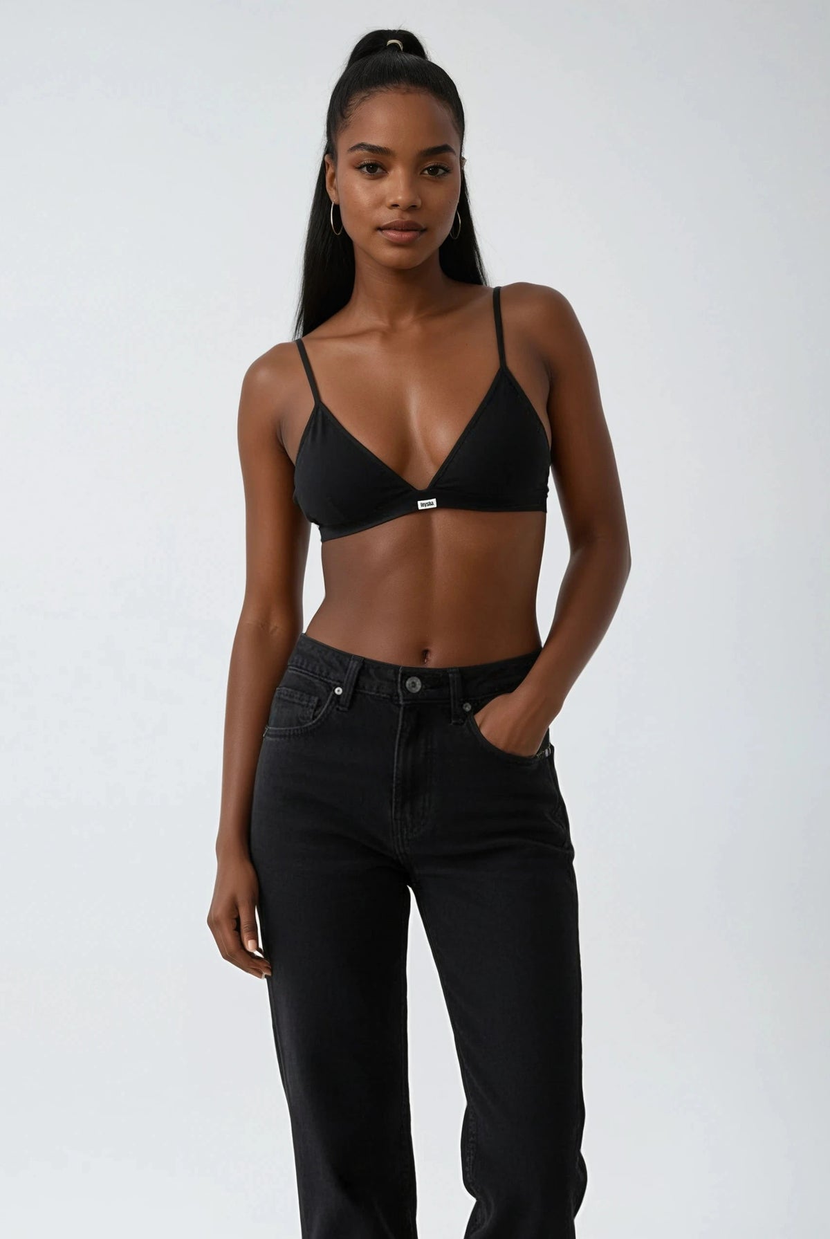 teysha triangle black edition set in organic cotton, styled with black jeans