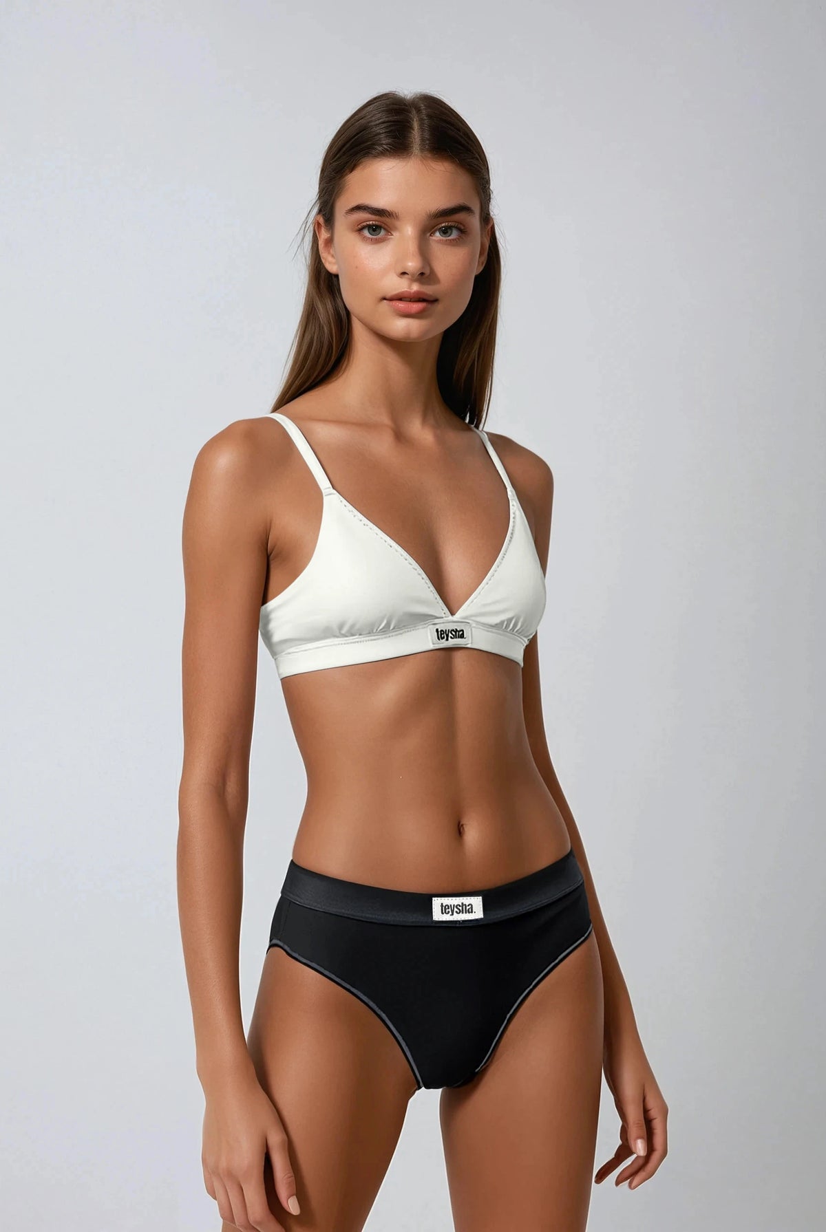 teysha organic cotton triangle bra in cloud white on model with black briefs