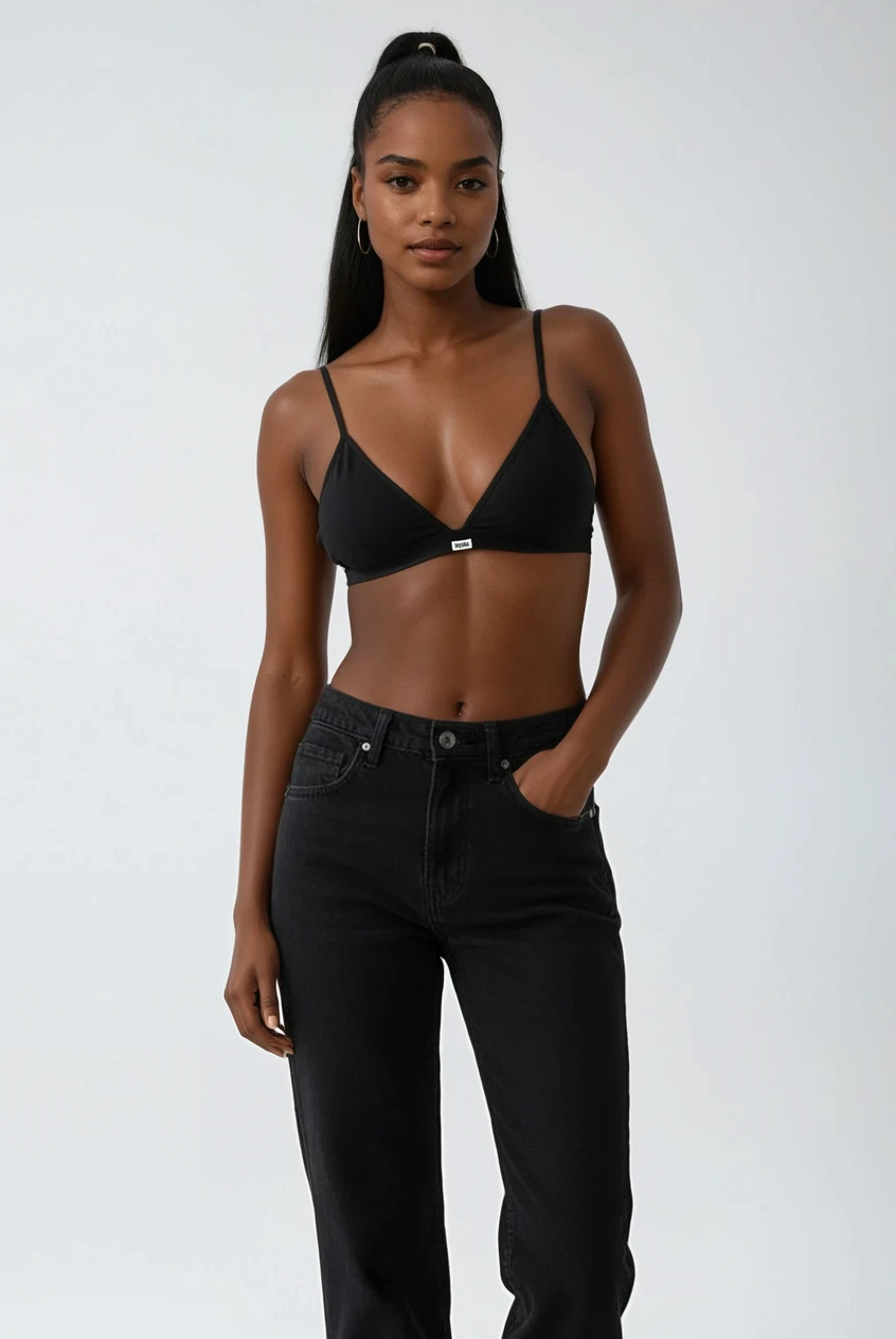 teysha organic cotton triangle bra in black, on model with black jeans