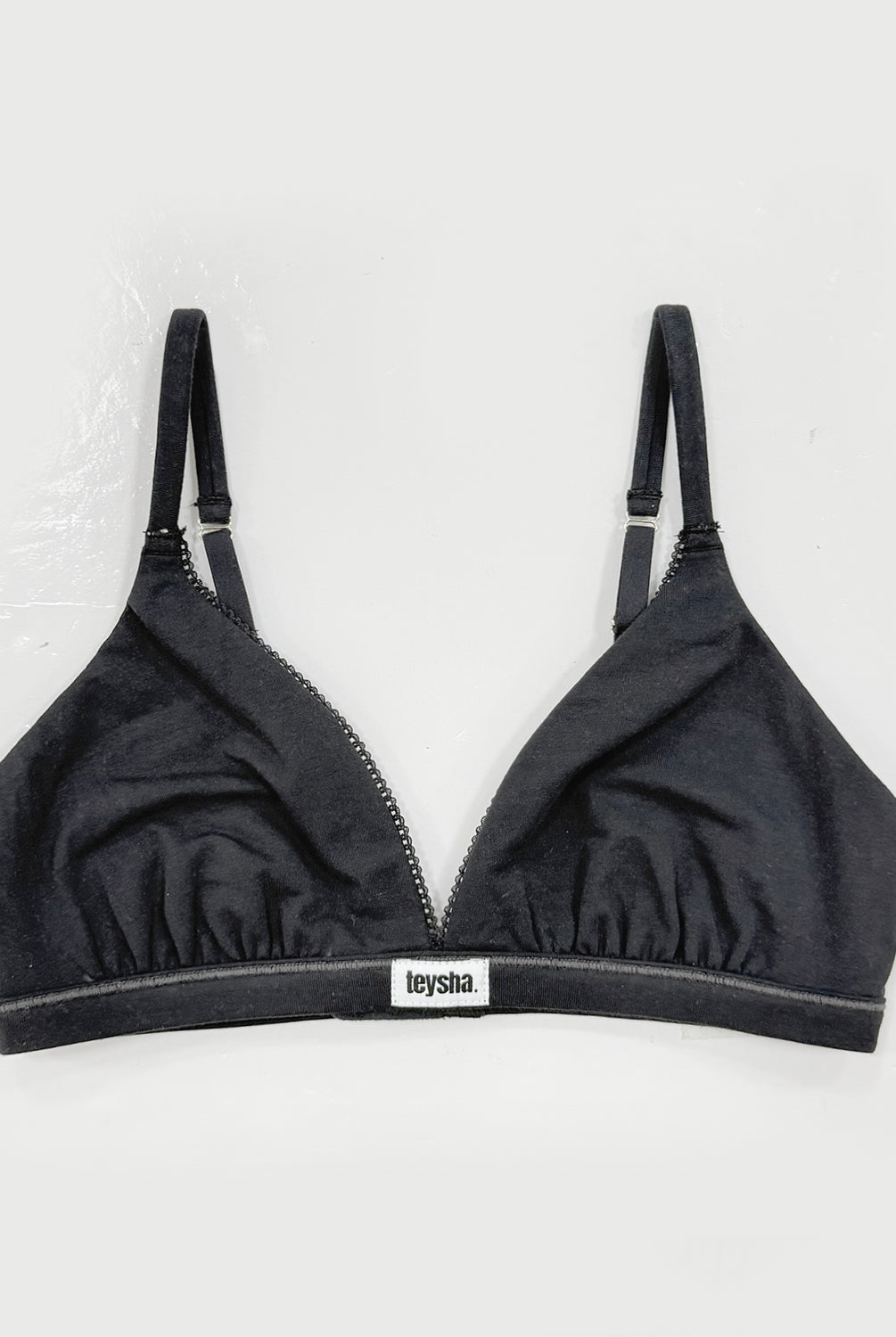 teysha organic cotton triangle bra in black, front view on light grey background