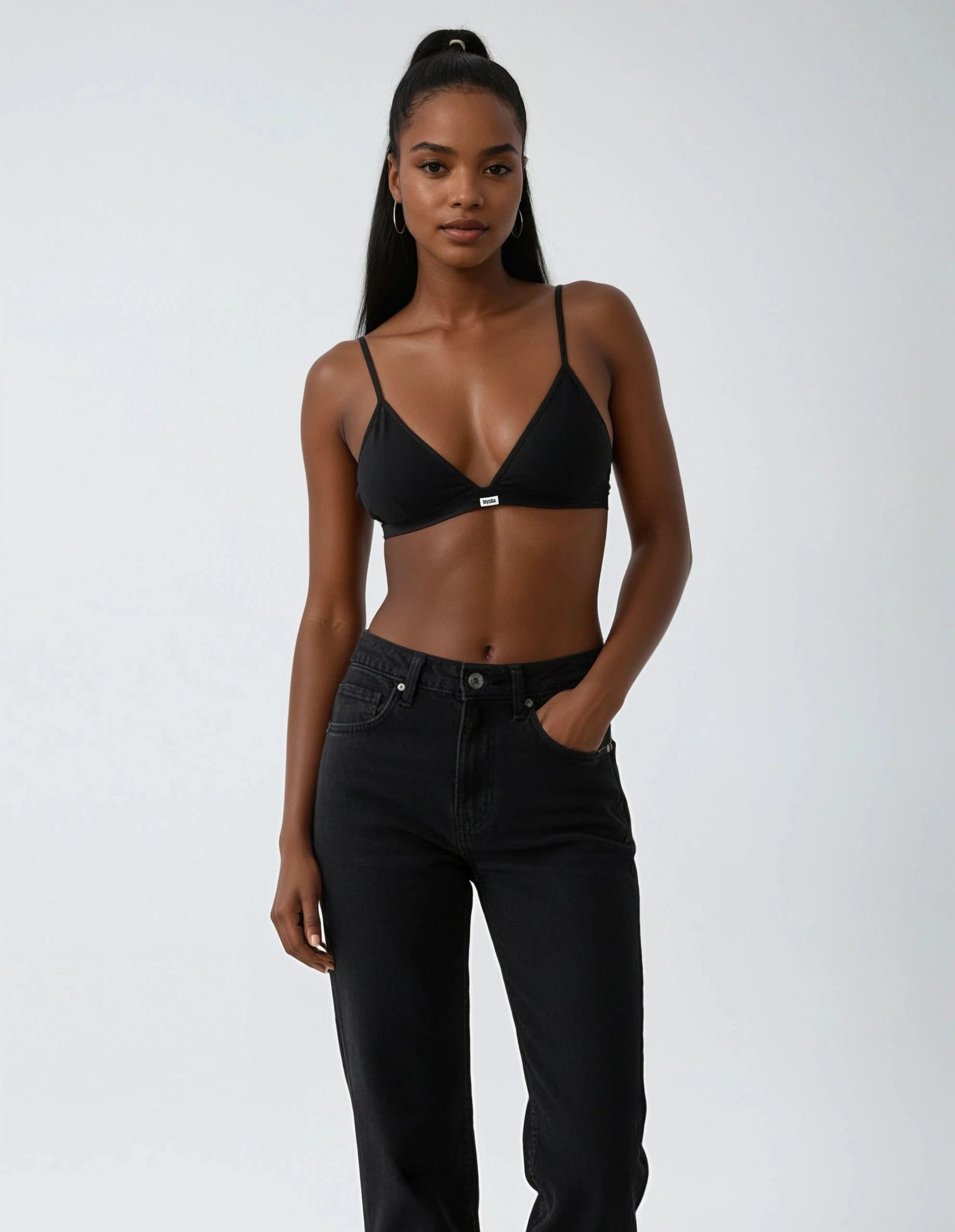 teysha triangle black edition set in organic cotton, styled with black jeans