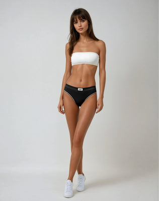 A model wearing white bandeau bra by teysha