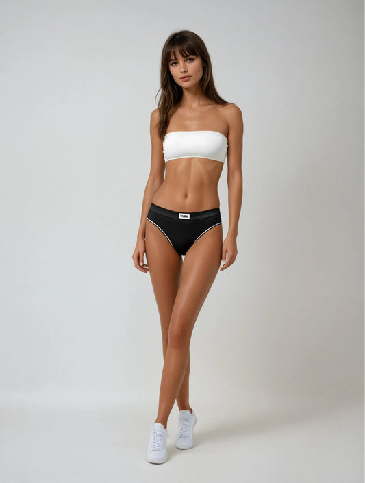 A model wearing white bandeau bra by teysha