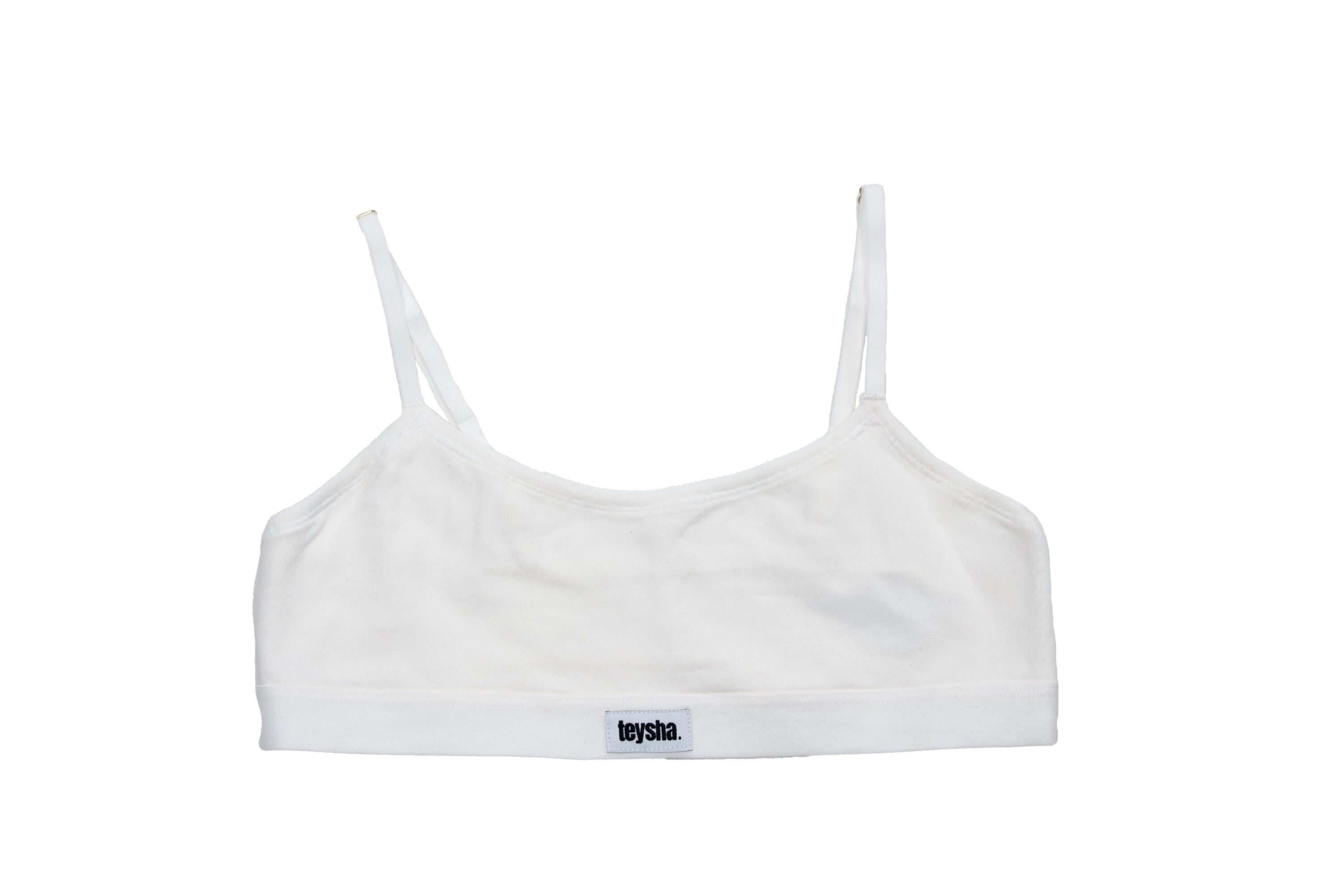 White sports bra with thin straps on a white background