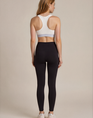 teysha organic cotton sports bra in white, racerback view on model
