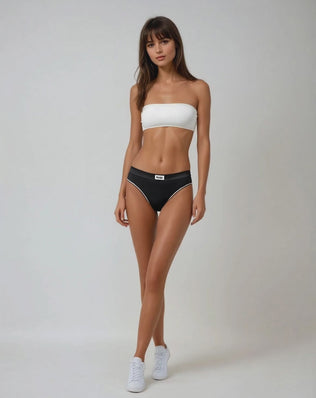 A model wearing a white bandeau bra by teysha