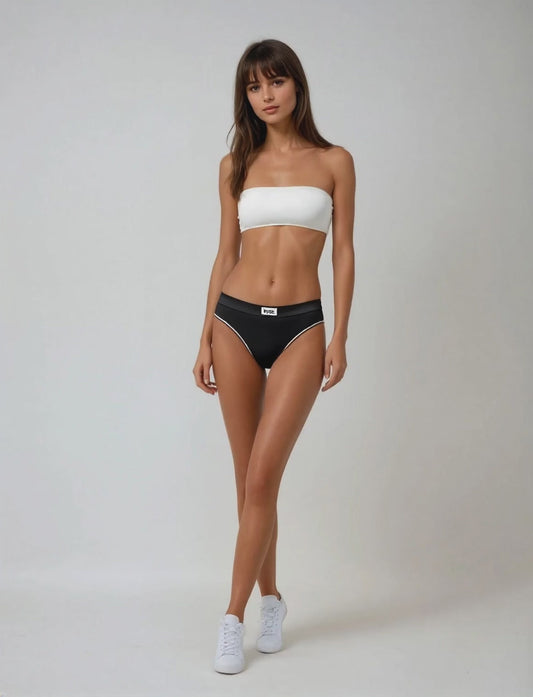 A model wearing a white bandeau bra by teysha